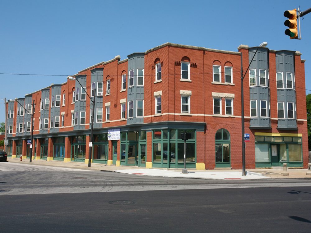 Historic three-story brick mixed-use building at East 55th Street, Cleveland.