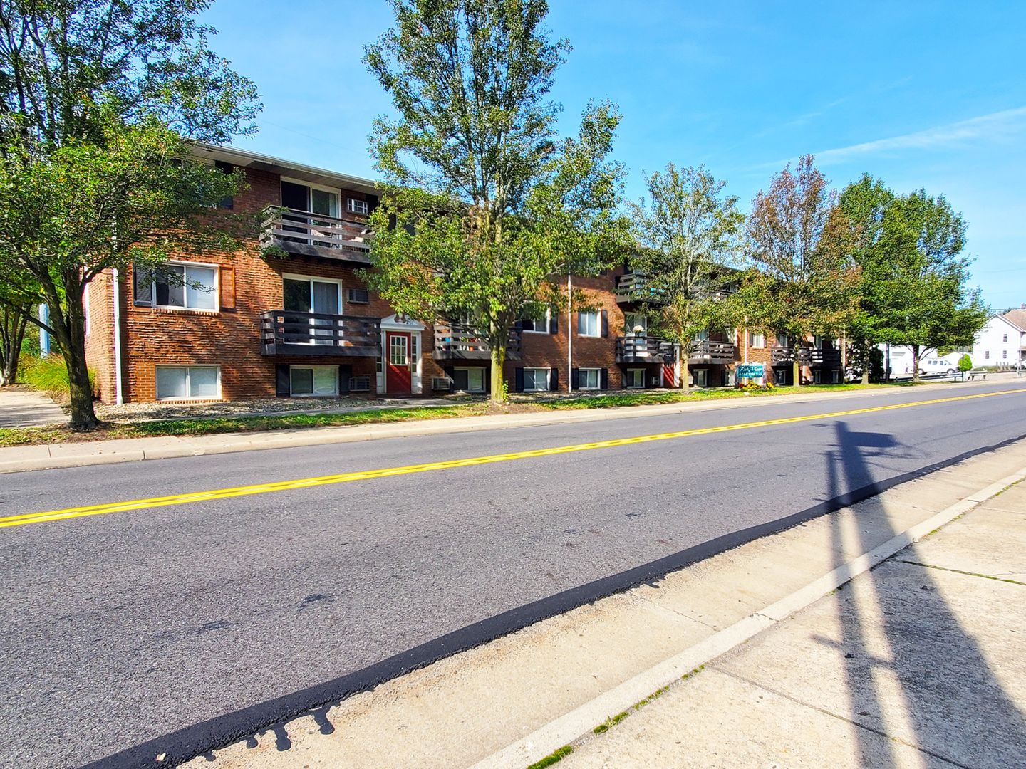 Hall of Fame Apartments exterior along a residential street.